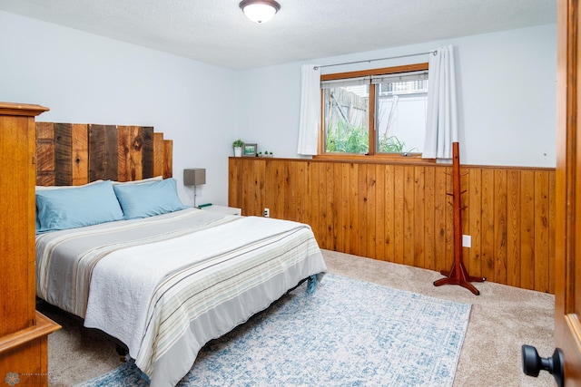 carpeted bedroom with a textured ceiling