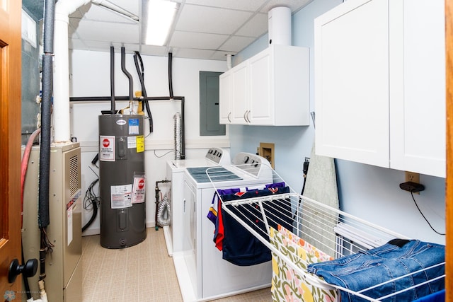 laundry area featuring electric water heater, cabinets, electric panel, and independent washer and dryer