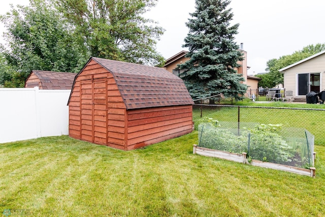 view of outbuilding with a lawn