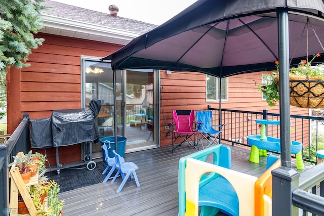 wooden deck featuring a gazebo