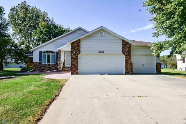 ranch-style home with a garage and a front lawn