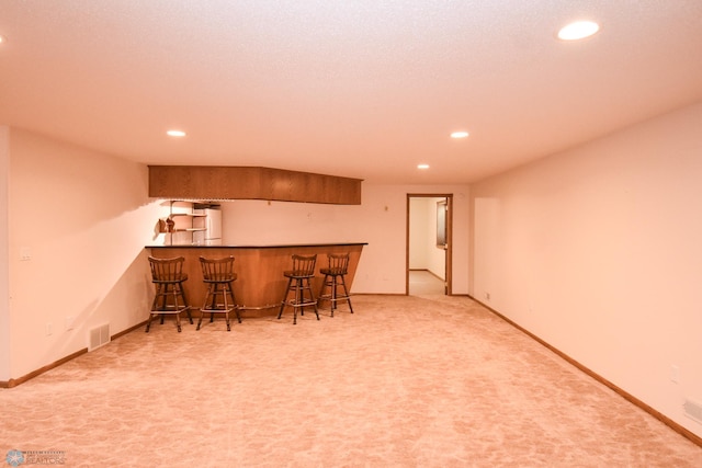 interior space featuring carpet floors and white refrigerator