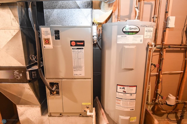 utility room featuring electric water heater