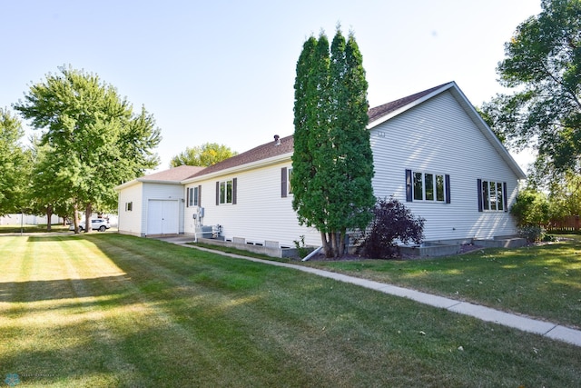 view of property exterior featuring a garage and a lawn