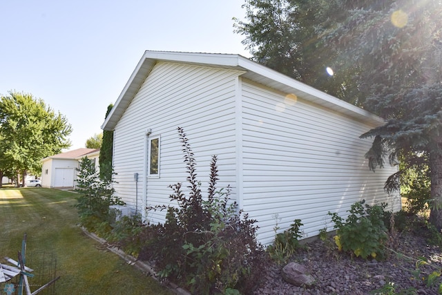 view of home's exterior with a yard