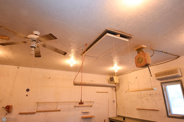 details featuring ceiling fan and a wall mounted AC