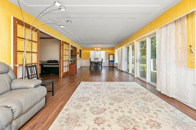 living room featuring a textured ceiling and hardwood / wood-style flooring