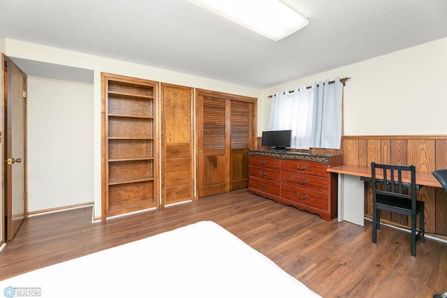 office area featuring a textured ceiling and dark hardwood / wood-style floors