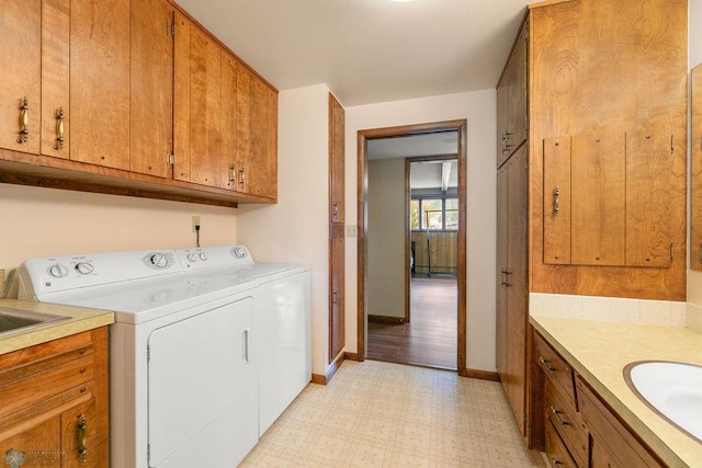 laundry room featuring light hardwood / wood-style floors and independent washer and dryer