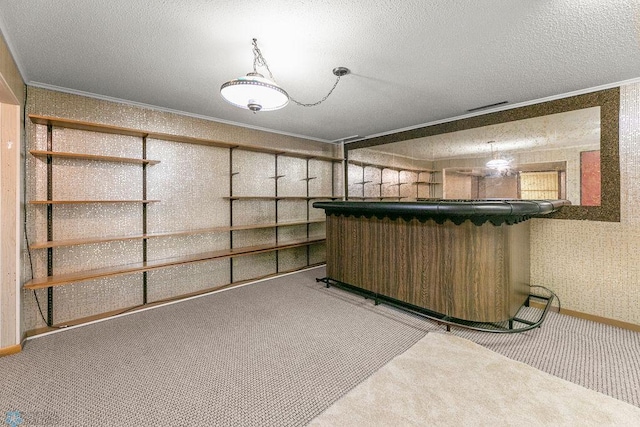 basement featuring bar, crown molding, light colored carpet, and a textured ceiling