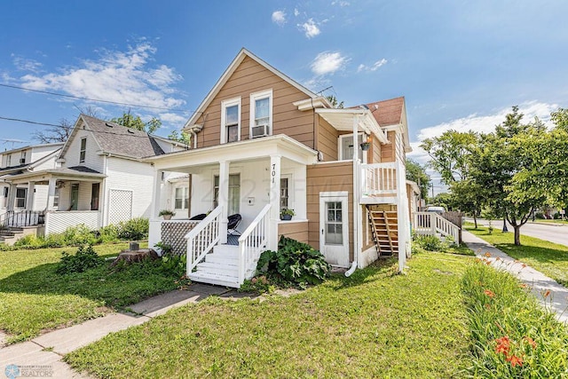 view of front of property featuring a front lawn and covered porch