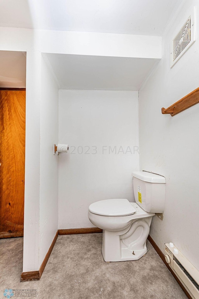 bathroom featuring a baseboard radiator and toilet