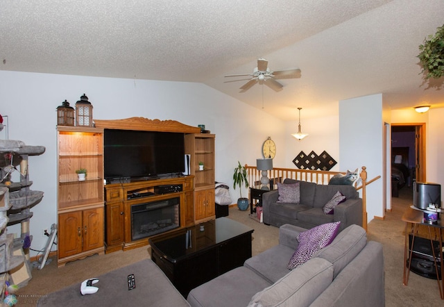 carpeted living room featuring ceiling fan, a textured ceiling, and vaulted ceiling