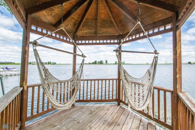 dock area featuring a gazebo and a water view