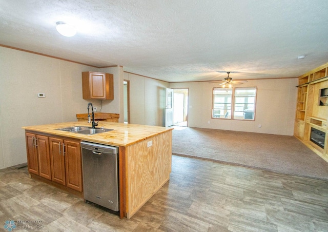 kitchen with sink, a textured ceiling, dishwasher, ceiling fan, and light colored carpet