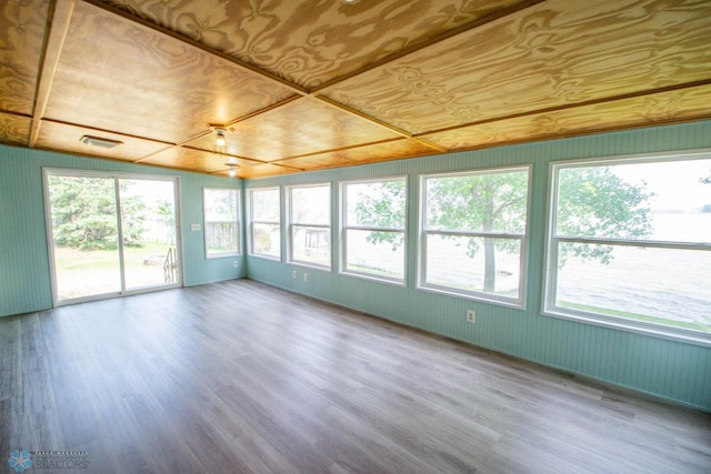 unfurnished sunroom featuring lofted ceiling and wooden ceiling