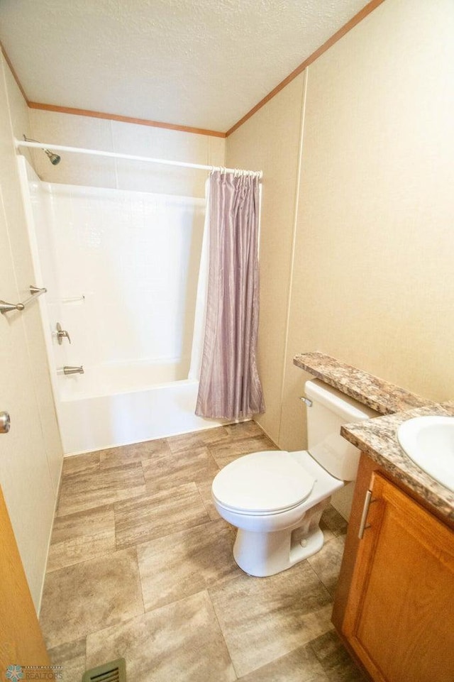 full bathroom with toilet, tile patterned flooring, vanity, shower / tub combo, and a textured ceiling