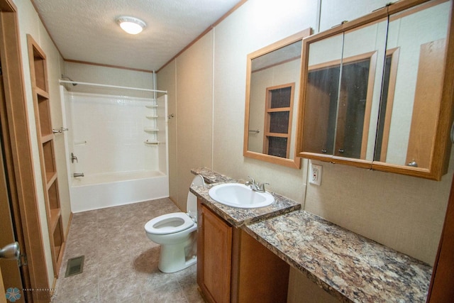 full bathroom featuring tub / shower combination, a textured ceiling, tile patterned flooring, vanity, and toilet