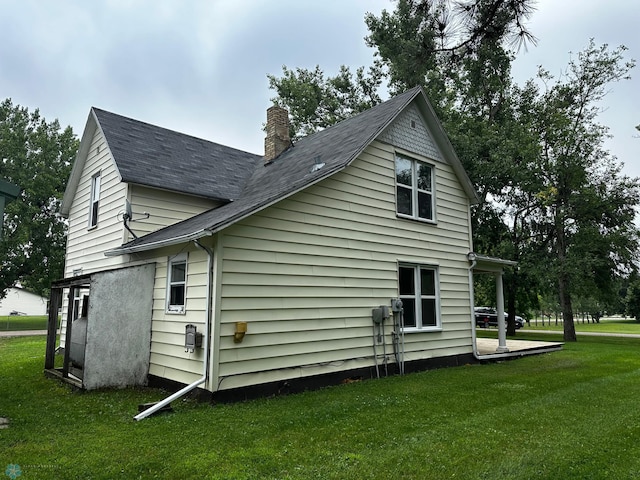 view of home's exterior featuring a yard