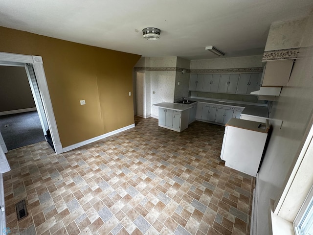 kitchen with sink and tile patterned flooring