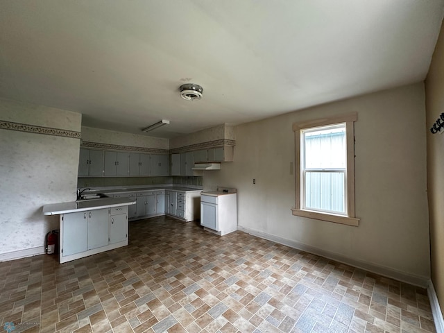 kitchen with sink and tile patterned floors