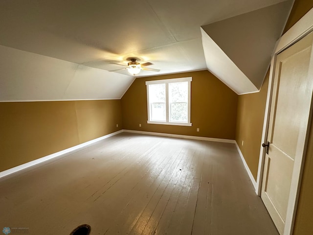 bonus room featuring hardwood / wood-style flooring, lofted ceiling, and ceiling fan