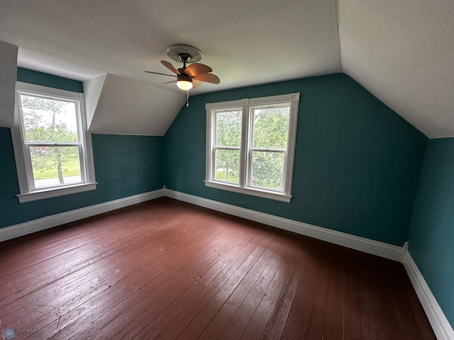 additional living space featuring ceiling fan, a textured ceiling, lofted ceiling, and wood-type flooring