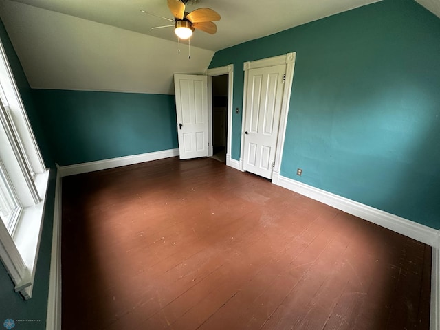 additional living space with ceiling fan, vaulted ceiling, and wood-type flooring