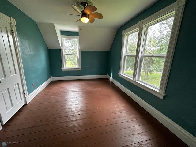 additional living space with ceiling fan, dark wood-type flooring, and lofted ceiling