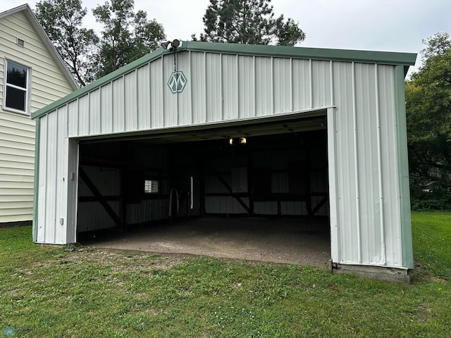 garage featuring a lawn