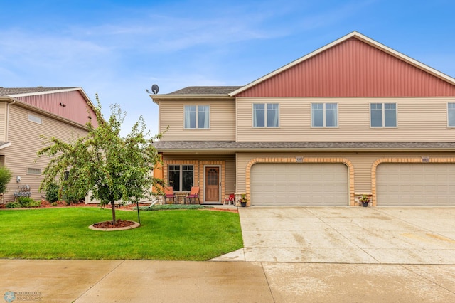 view of front of house featuring a front yard and a garage