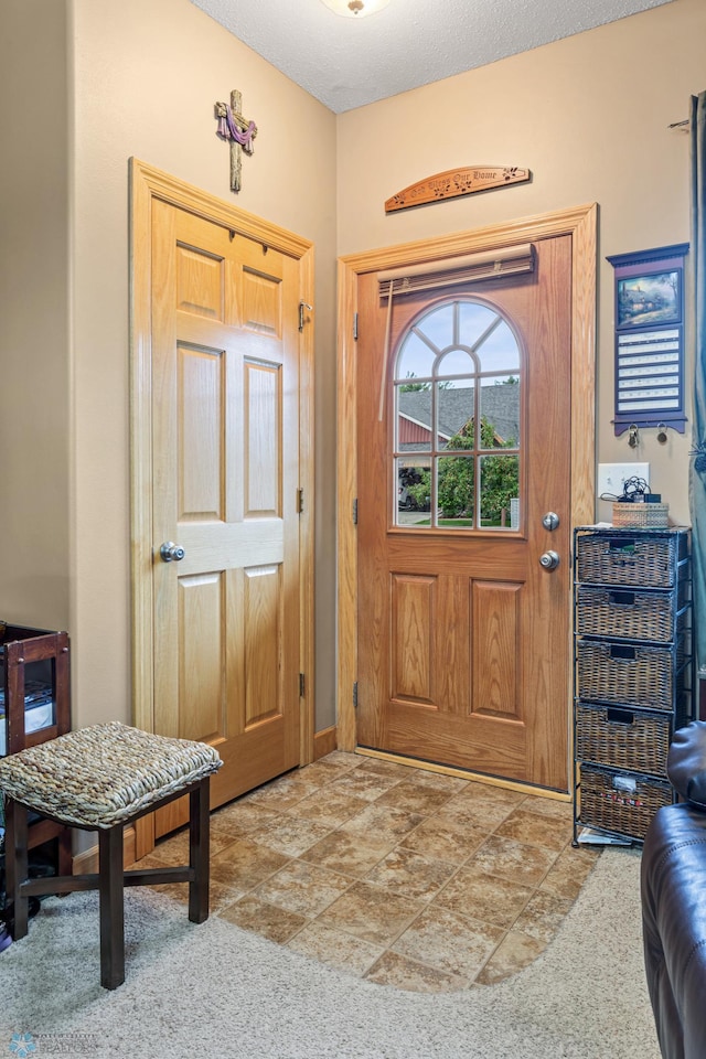 foyer entrance with tile patterned floors