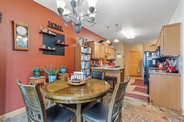 dining room featuring light tile patterned floors, a textured ceiling, and a chandelier