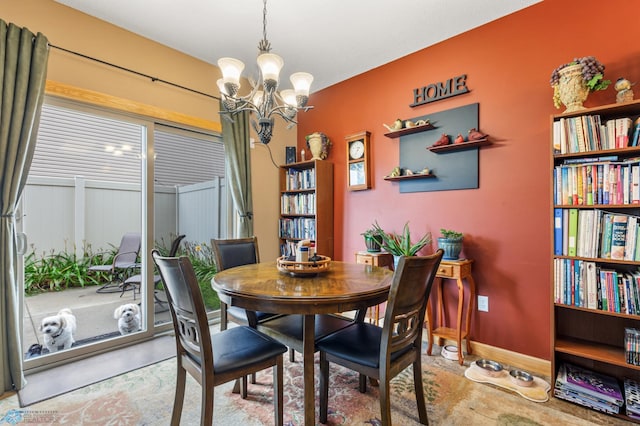 dining space with a chandelier