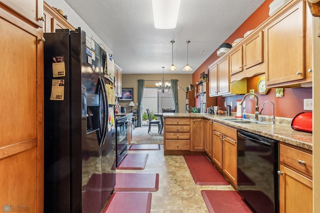 kitchen featuring sink, black appliances, a textured ceiling, light tile patterned floors, and kitchen peninsula