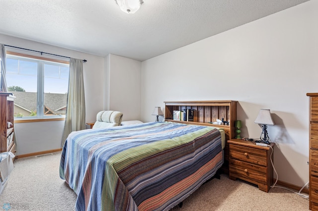 carpeted bedroom with a textured ceiling