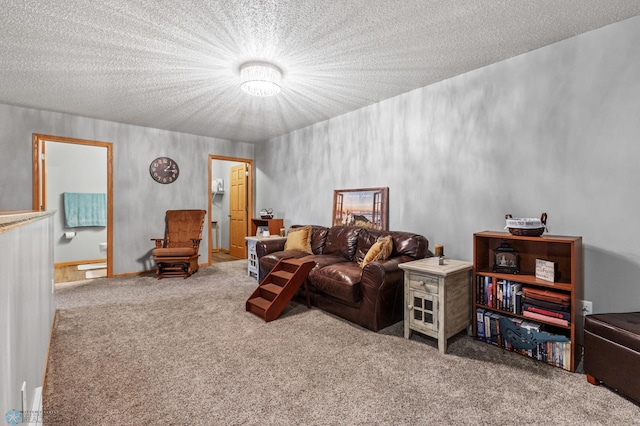 carpeted living room featuring a textured ceiling