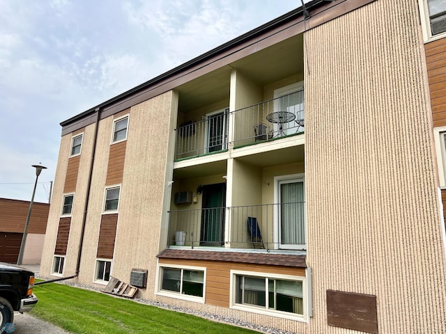 view of building exterior featuring central AC