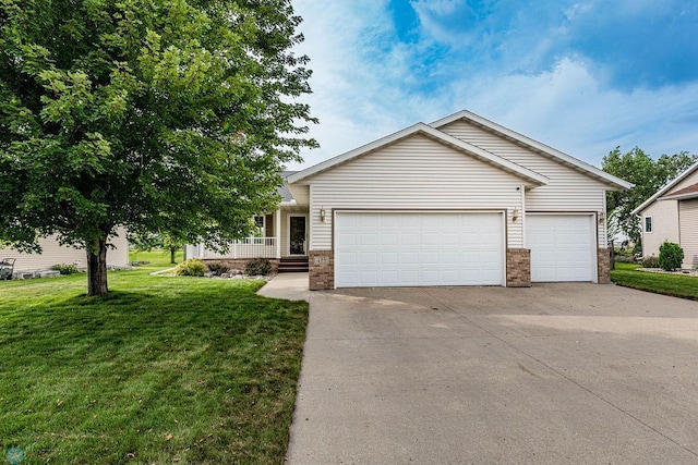 view of front of home featuring a garage and a front yard