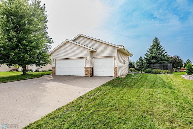 ranch-style house with a garage and a front yard