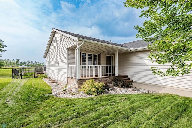 ranch-style house with a front lawn and a porch