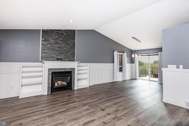 unfurnished living room featuring high vaulted ceiling, a stone fireplace, and wood-type flooring