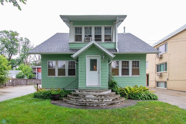 view of front of property with a front lawn