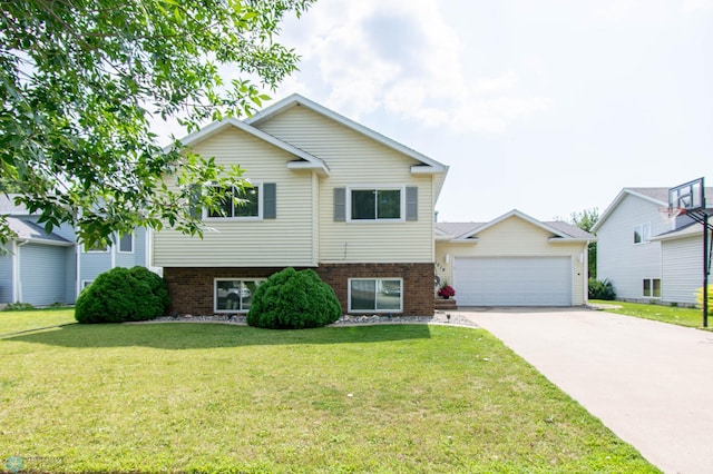 tri-level home featuring a garage and a front yard