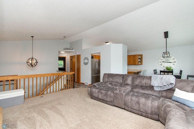 carpeted living room featuring an inviting chandelier and lofted ceiling