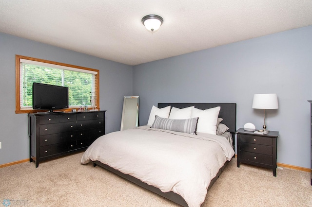 bedroom featuring light colored carpet