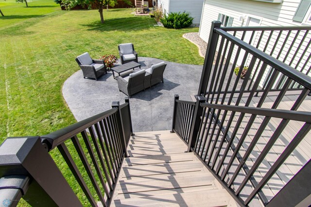 exterior space featuring an outdoor living space, a patio, and a yard