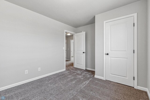 unfurnished bedroom featuring carpet flooring