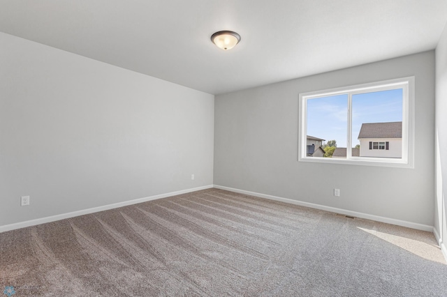 empty room featuring carpet flooring