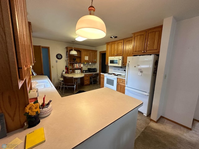 kitchen with hanging light fixtures, kitchen peninsula, dark colored carpet, and white appliances